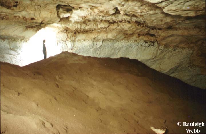 Adam Minchin standing on a rockpile BEHIND Mt Bridge which is a monolith of bat guano!!!! Unfortunately previous visitors have walked over the guano piles causing considerable damage. - 1997 - Nullarbor Jan